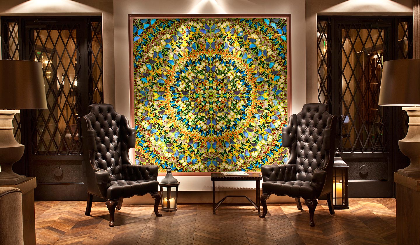 Large mosaic artwork on walk with two high back chairs at Rancho Santa Fe resort