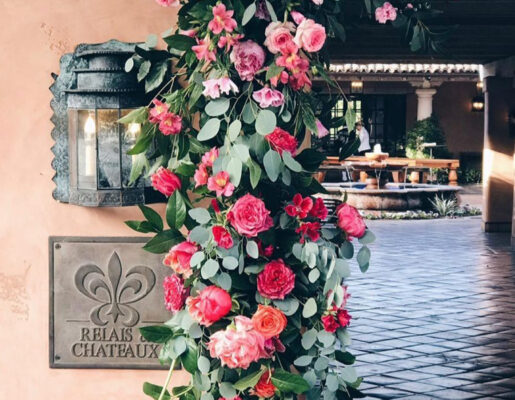 relais & chateux sign with lantern and pink flowers