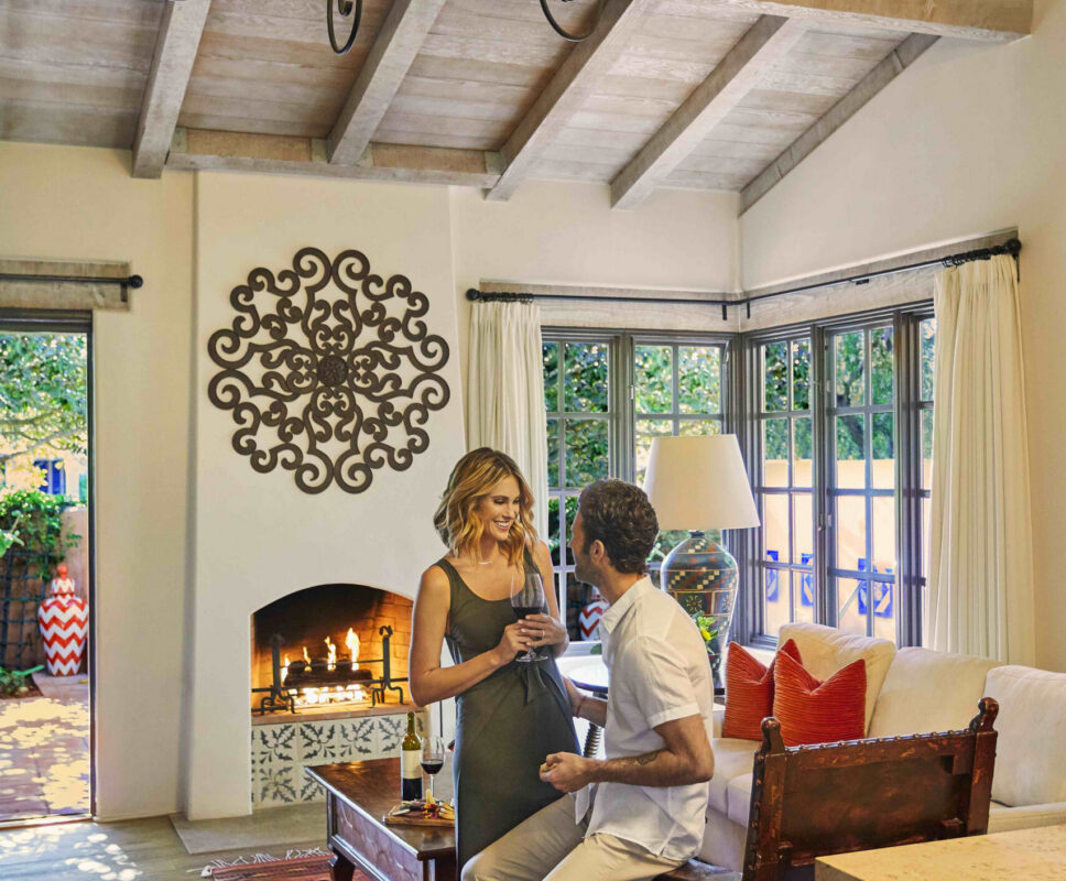 Couple sitting in the Valencia suite living room