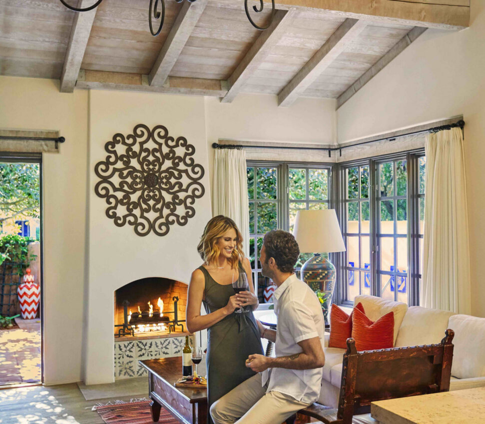 Couple sitting in the Valencia suite living room