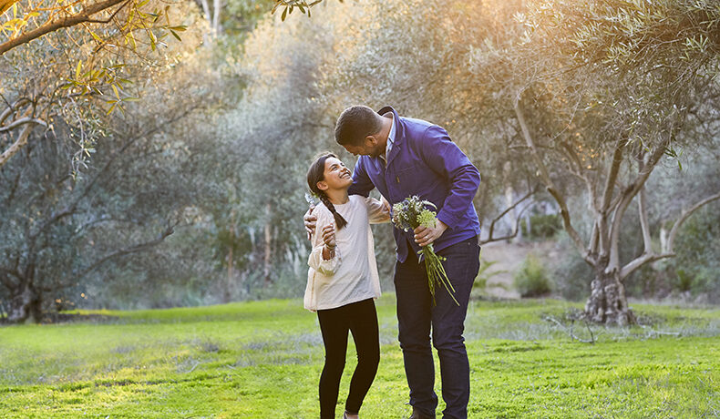 Father and daughter embracing in the olive groves