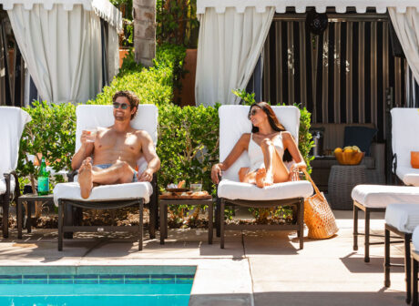 Couple lounging poolside at spa