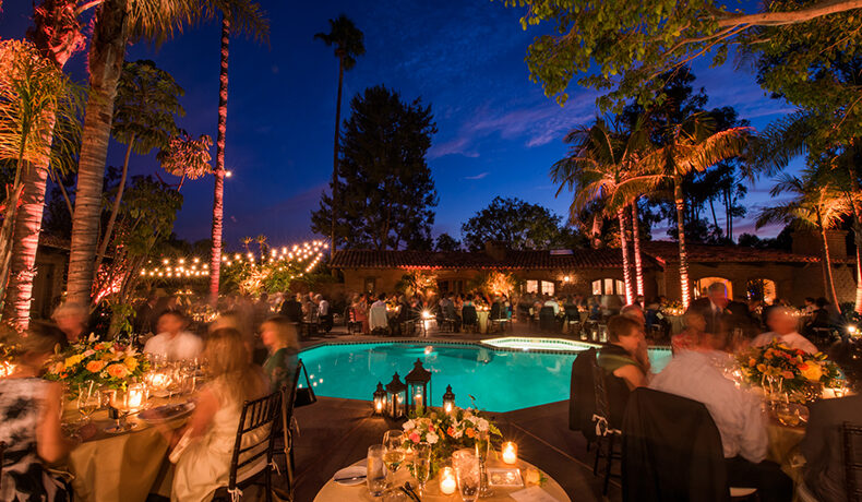 dining area by the hacienda pool at night