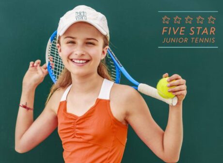 young girl with tennis racket and tennis ball