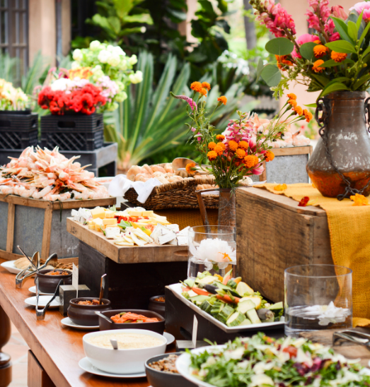 buffet of food with flower decorations