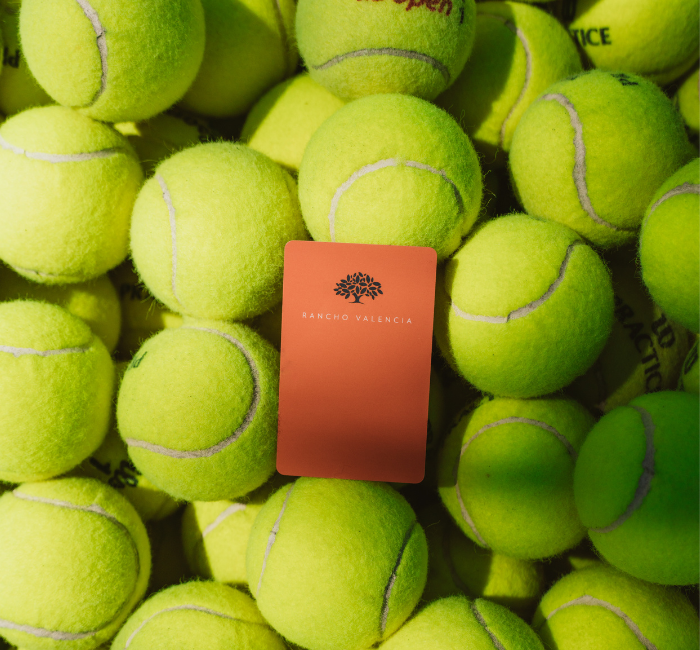 tennis balls with a rancho valencia key card
