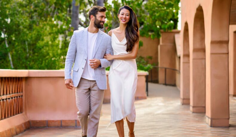 couple walking across Terrace Room Patio