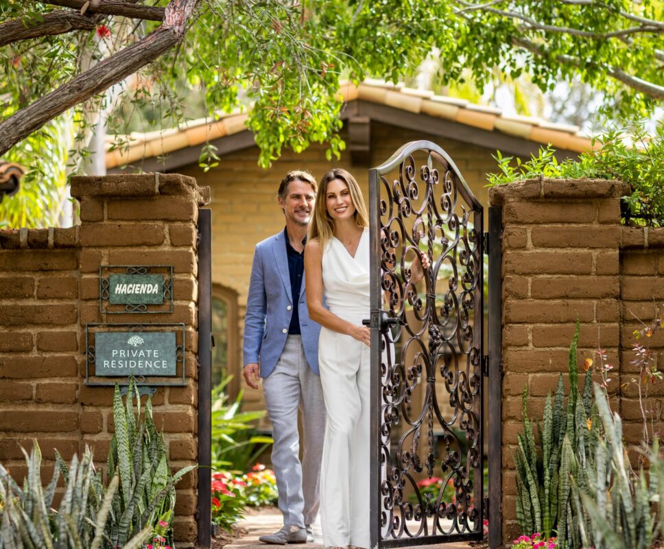 Caucasian couple walking out of Hacienda