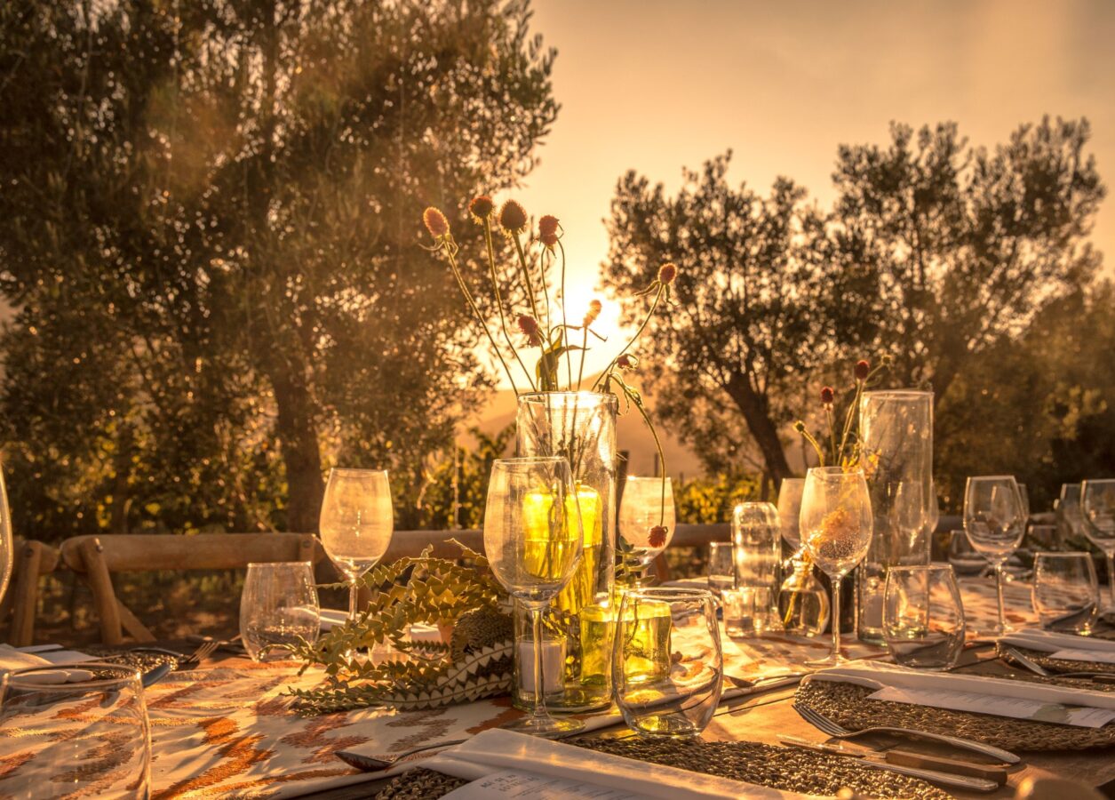 a dining table outside at sunset