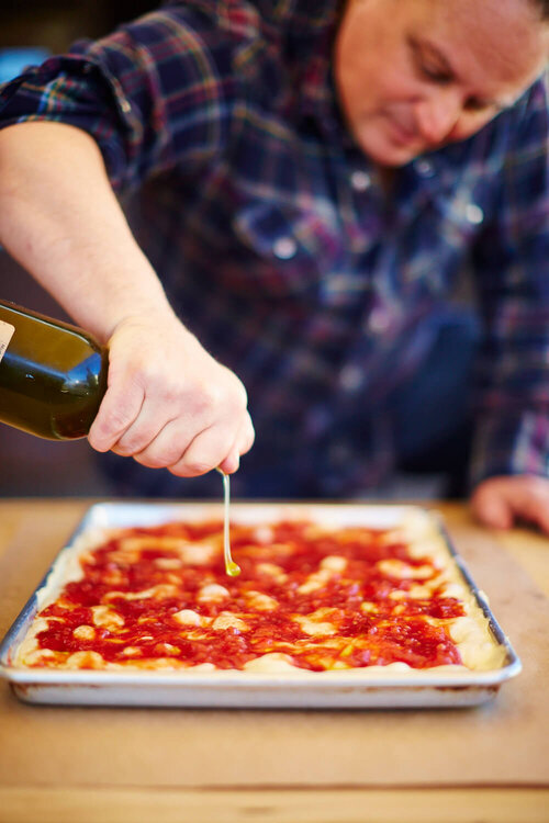 Chef Chris Bianco drizzling olive oil
