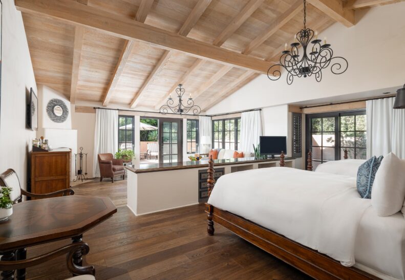 Olive Grove Two Queen ADA living area looking from bed area, and door to patio