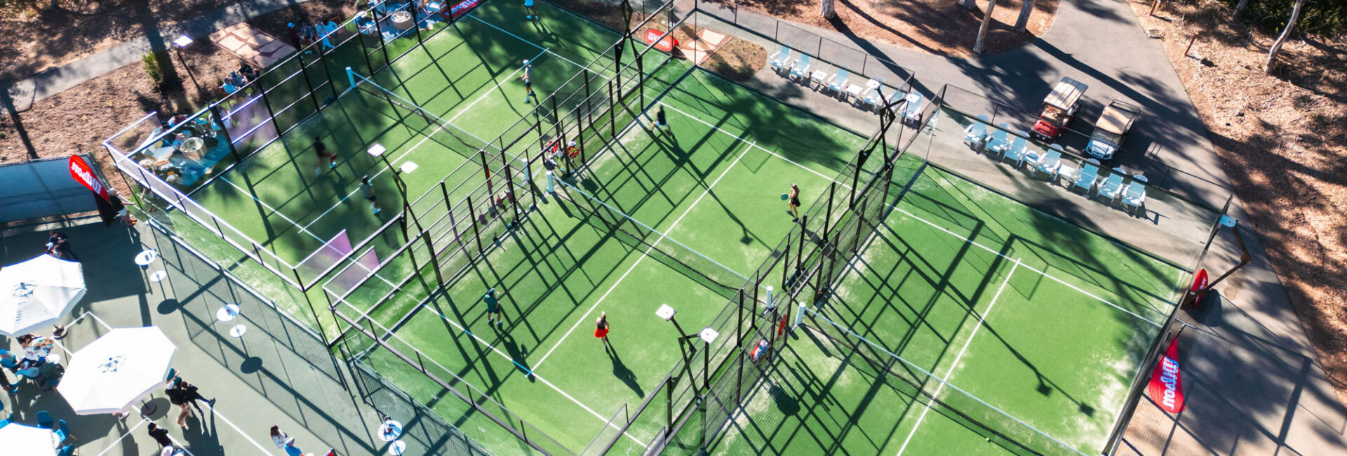 Aerial view of multiple padel courts.